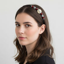 Load image into Gallery viewer, Woman wearing a decorative headband with beads and a coin on a plain background
