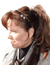 Load image into Gallery viewer, Woman wearing a side-embellished headband with and Enameled Acorn centerpiece and accented with crystal beads

