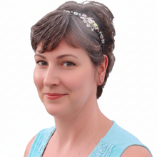 Load image into Gallery viewer, Woman wearing enameled green flower side-embellished flexible headband accented with Austrian crystal beads, Enameled Flower Headband
