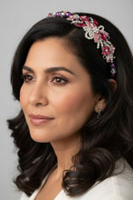 Load image into Gallery viewer, Woman wearing a decorative headband with flowers and beads against a gray background
