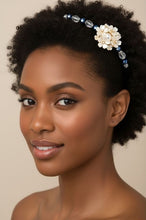 Load image into Gallery viewer, woman wearing flexible headband side-embellished with white faux pearl flowers, decorated with sparkly black and white Austrian crystal beads, Bouquet of Pearls Headband
