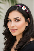 Load image into Gallery viewer, Woman wearing a decorative headband with beads and a pink flamingo.
